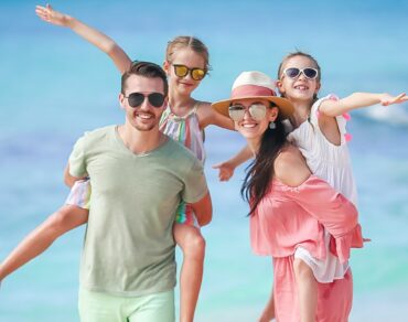 Young family on vacation on the beach