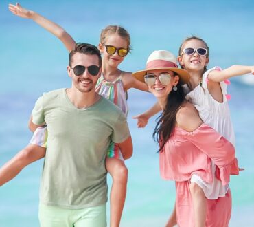 Young family on vacation on the beach